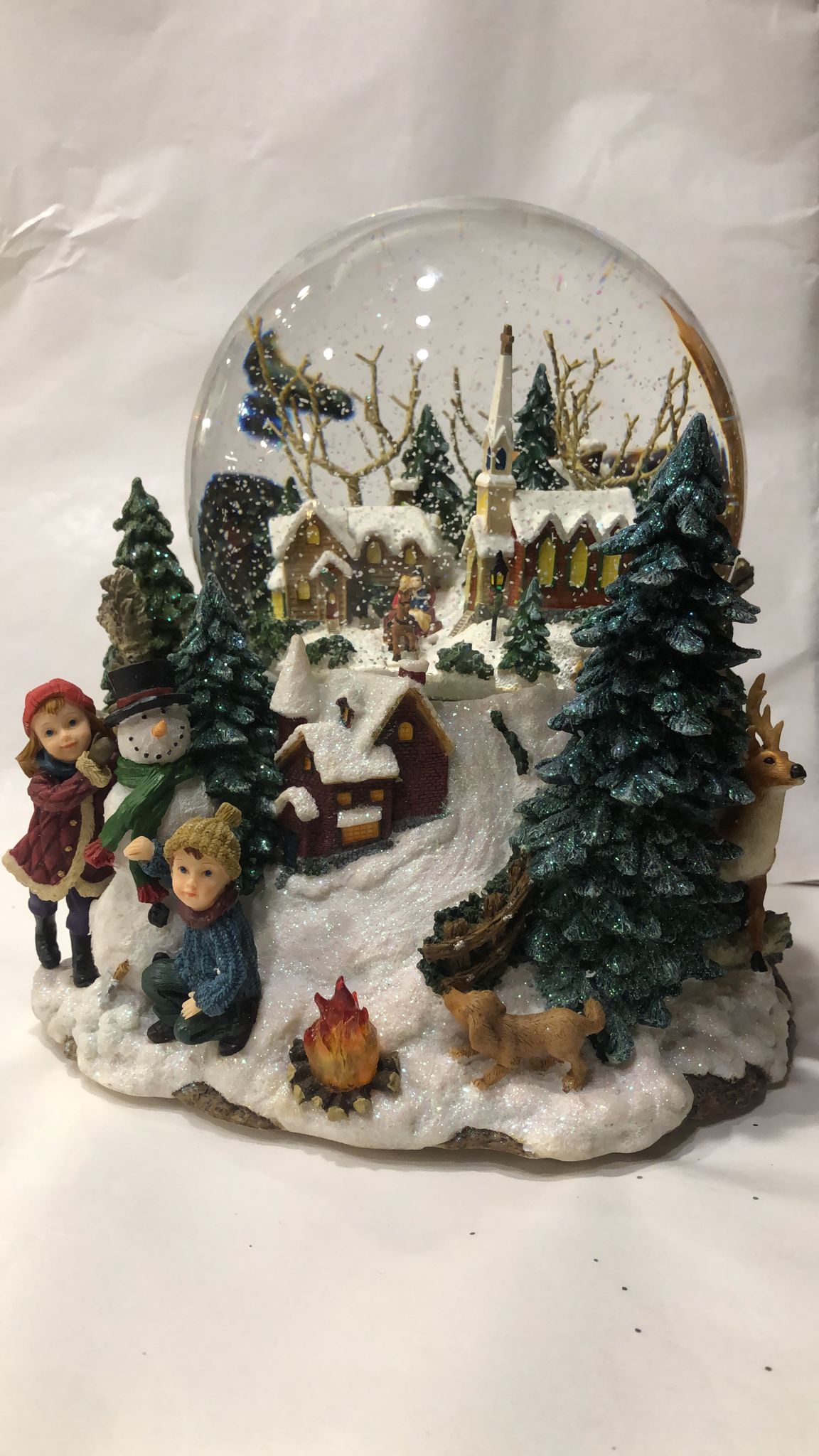 Snow globe village in the woods
